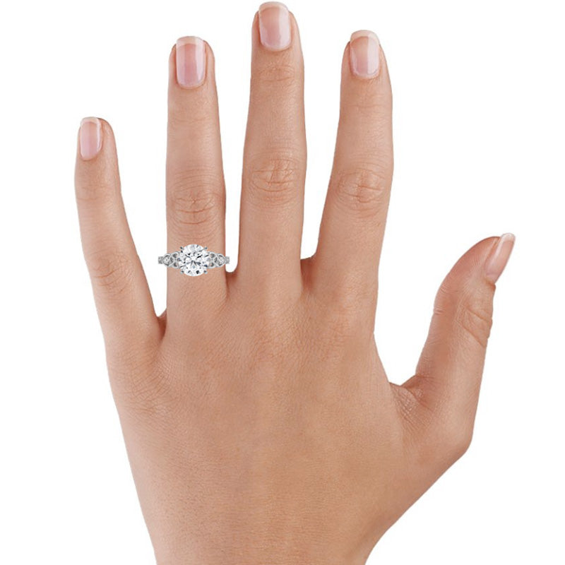 Vintage Three Stone Moissanite Scrollwork Engagement Ring