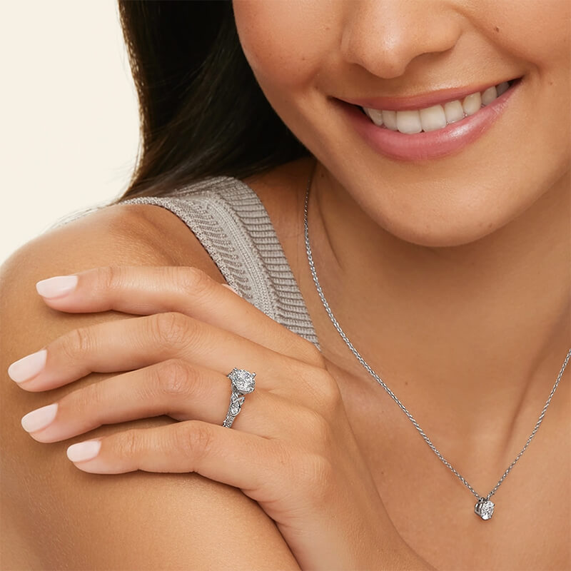 Vintage Three Stone Moissanite Scrollwork Engagement Ring